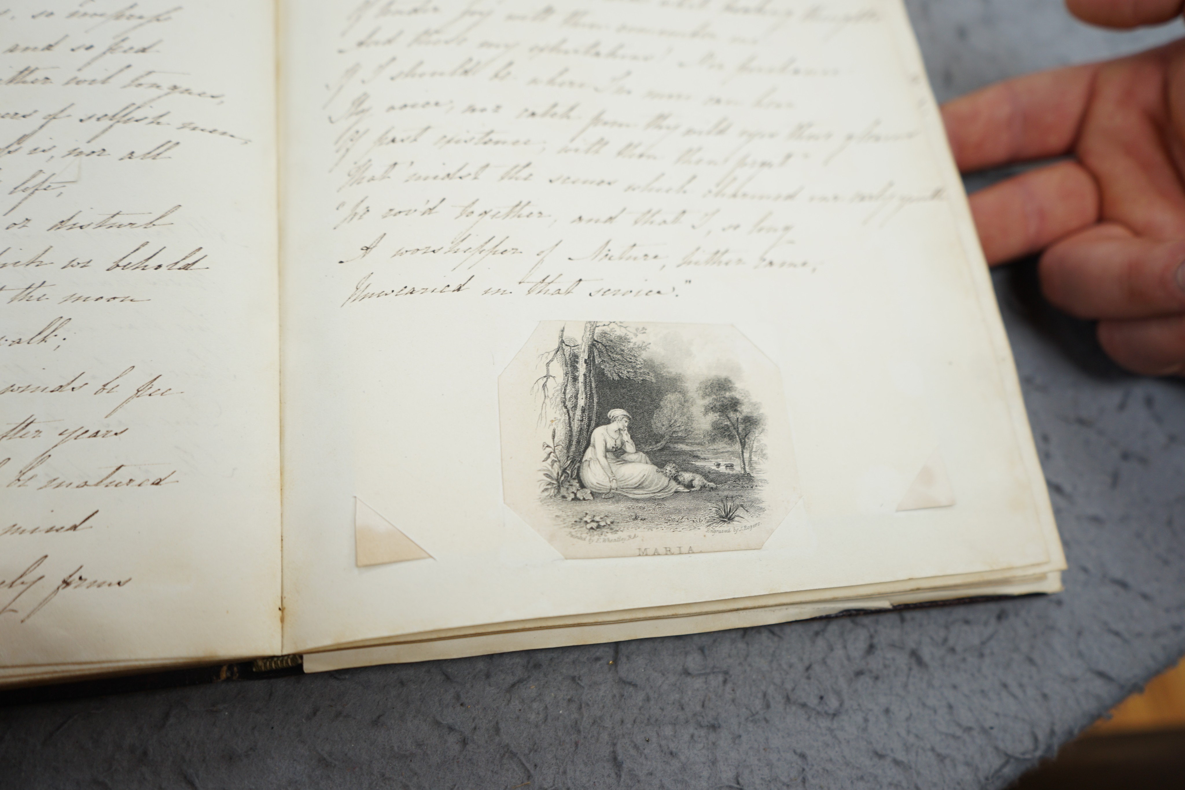 An early 19th century hand written journal, sketch book with scraps, coloured engravings, etc.